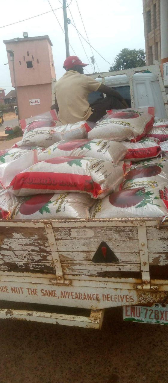A truck loaded with bags of rice for a community distribution